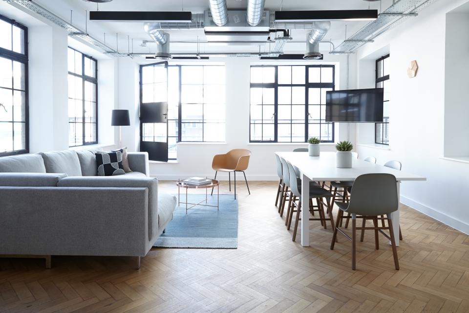 Loft-style living space with high ceilings and big windows